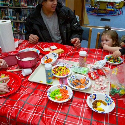 Just one of the many familes we had enjoying building Gingerbread Houses together!