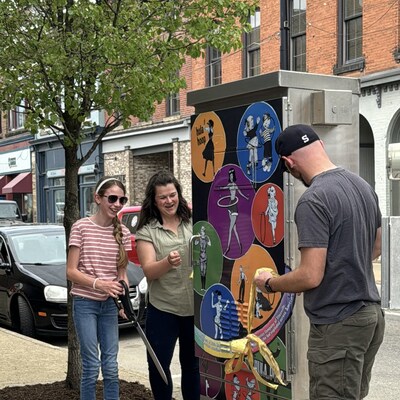 Ribbon cutting for the utility box covers in downtown Titusville.