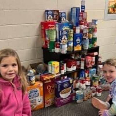 Students from Conneaut Valley Elementary School delivering donations from a food drive